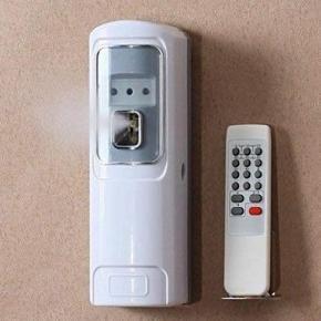 Auto air freshener dispenser with remote controller.